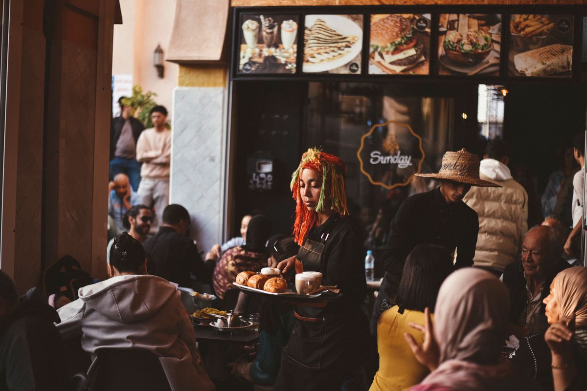 Busy café terrace with customers in Agadir, Morocco