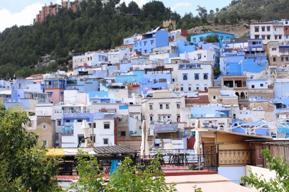 Blue buildings of Chefchaouen spread across a hillside in the Rif Mountains, Morocco