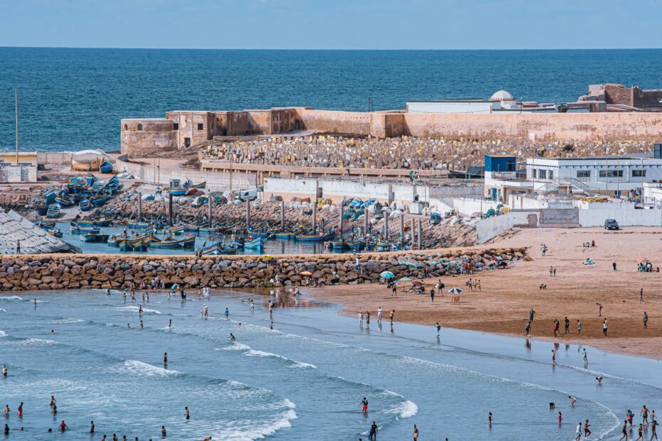 Aerial view of swimmers on El Jadida beach next to the walls of the Portuguese City of Mazagan, Morocco