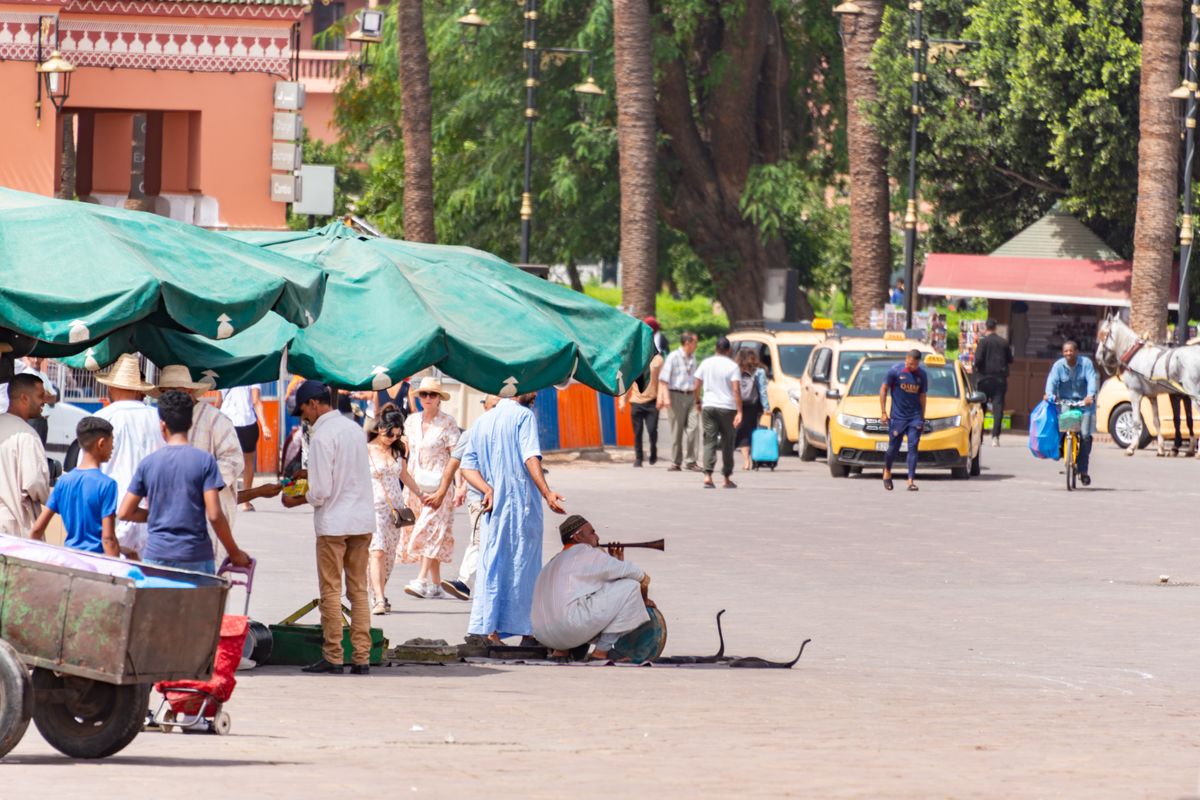 Jemaa el-Fna square in Marrakech with visitors and street performers