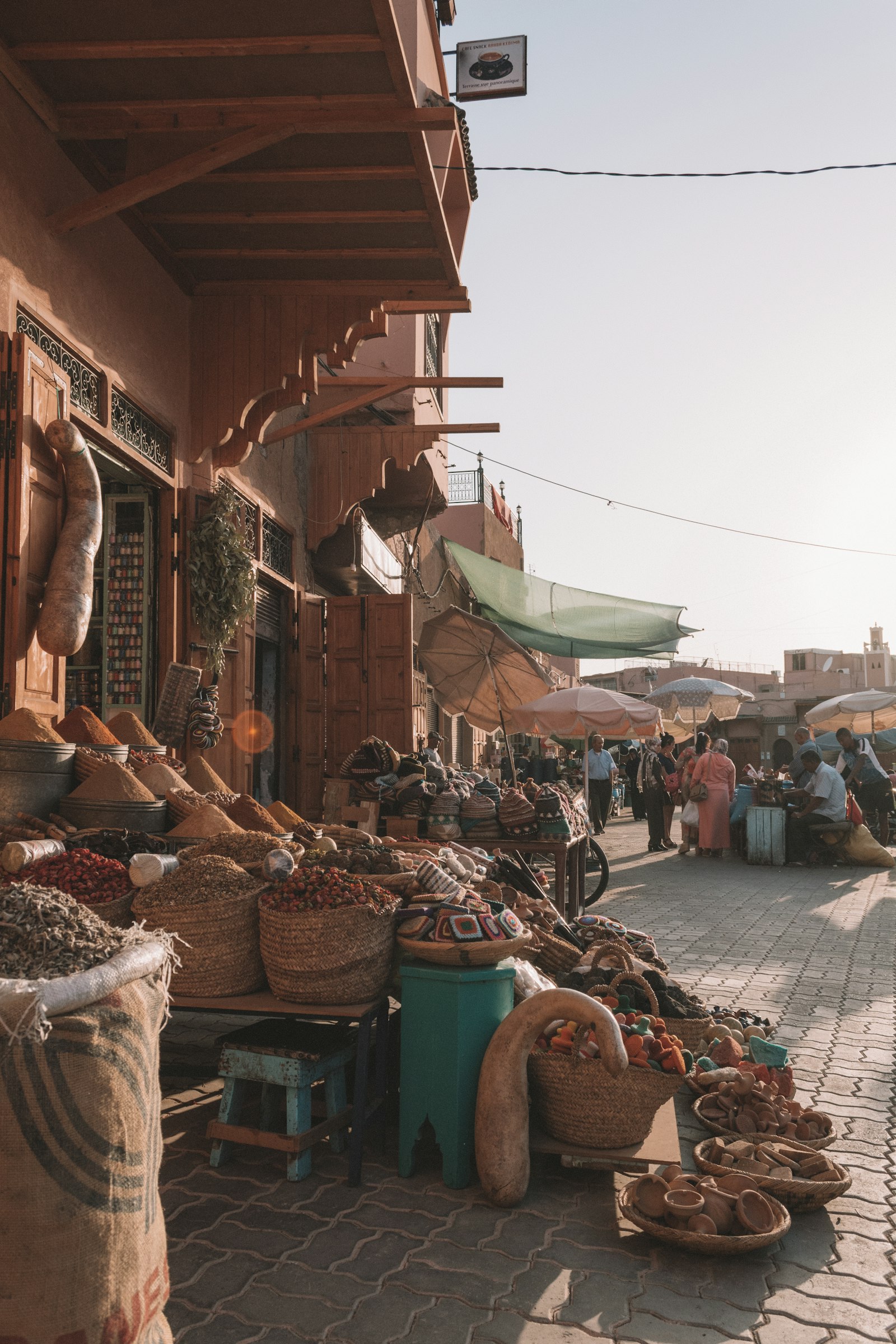 Stalls and shoppers in a souk of the Marrakech medina