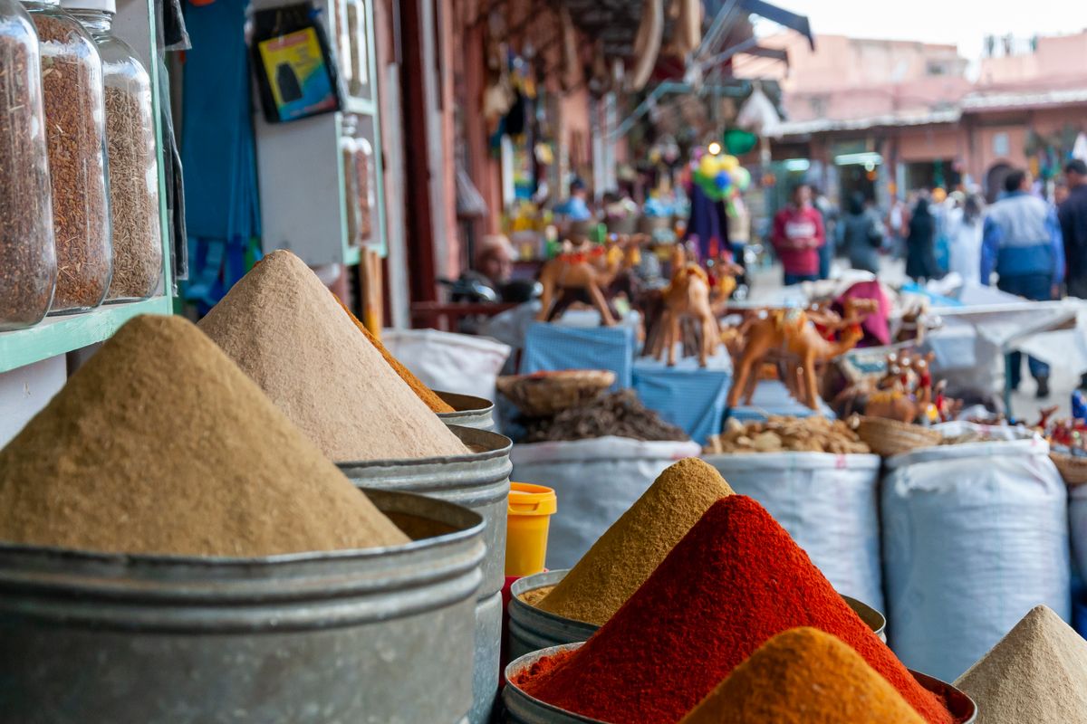 Colourful spices for sale at a market stall in Marrakech, Morocco