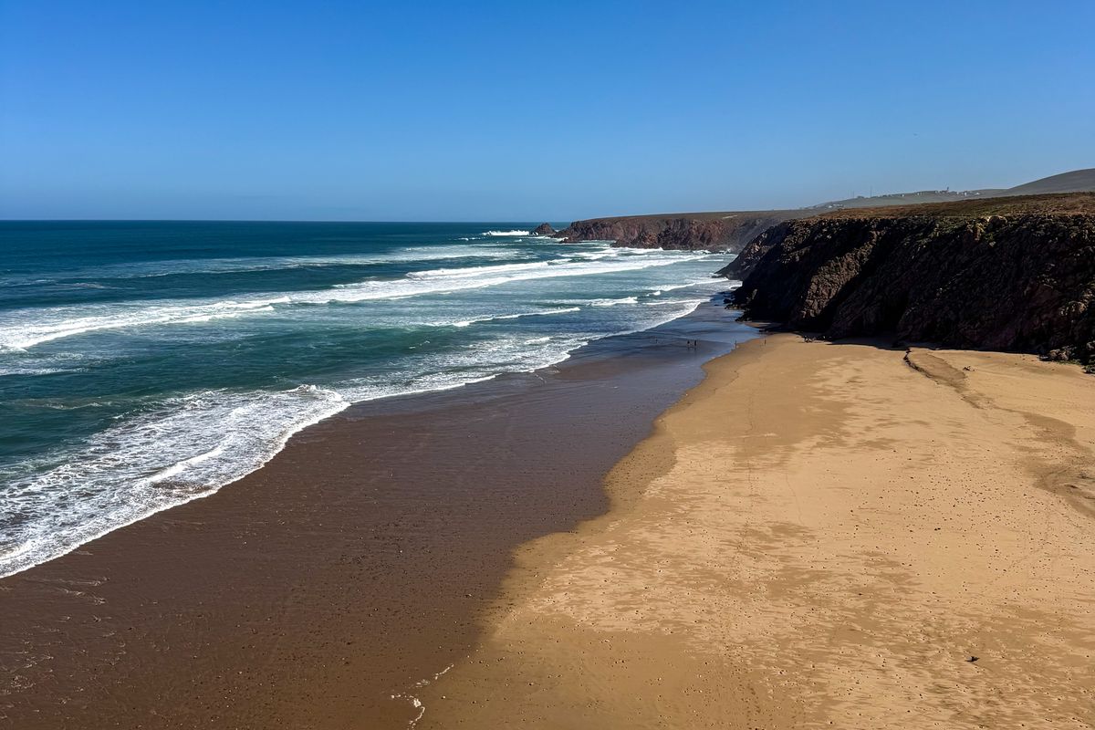 Clifftop view of waves rolling onto Mirleft Beach, southern Morocco