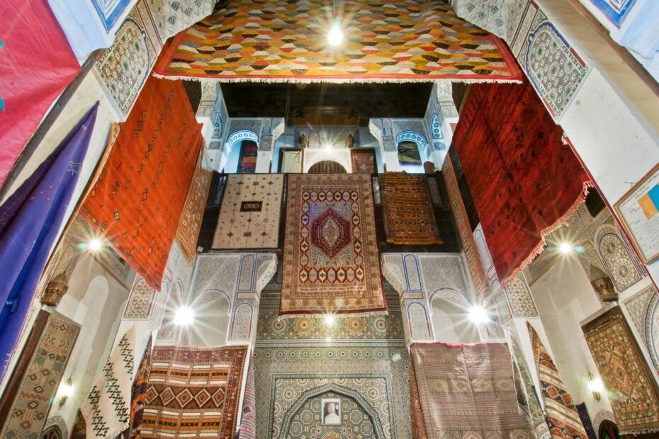 Colourful Moroccan rugs hanging in the historic medina of Fes, Morocco