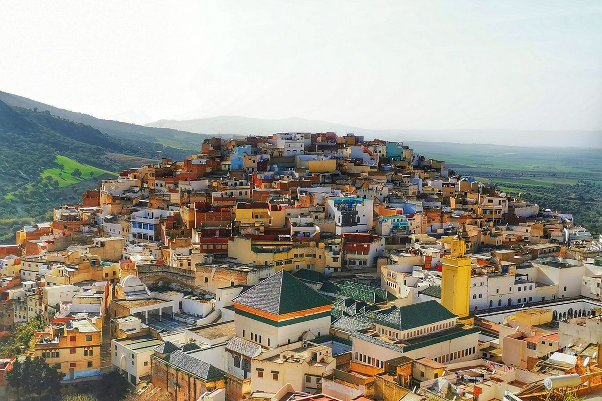 Aerial view of the white houses of Moulay Idriss Zerhoun on its hillside, Morocco