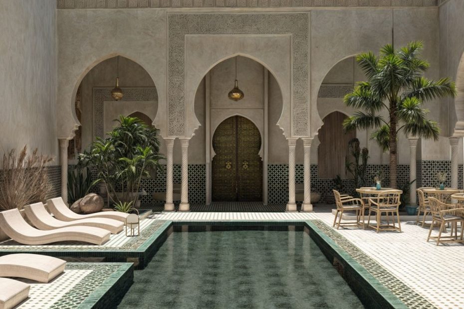 An elegant riad courtyard with a plunge pool, arches and tiles in Marrakech, Morocco