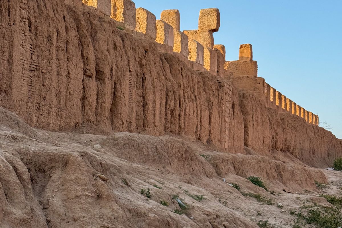 Mud-brick fortification wall of Taroudant, Morocco, glowing at sunset